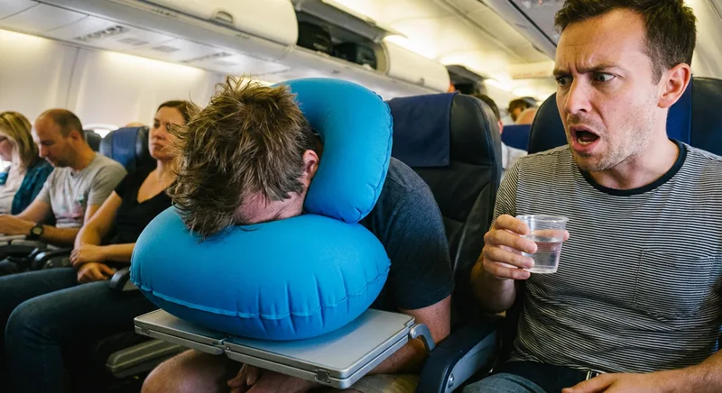 SkyRest Travel Pillow: A Blue Inflatable Boulder That You Faceplant Into for 8 Hours While Your Seatmate Questions Reality